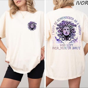 a woman wearing a t - shirt with a picture of a woman's face