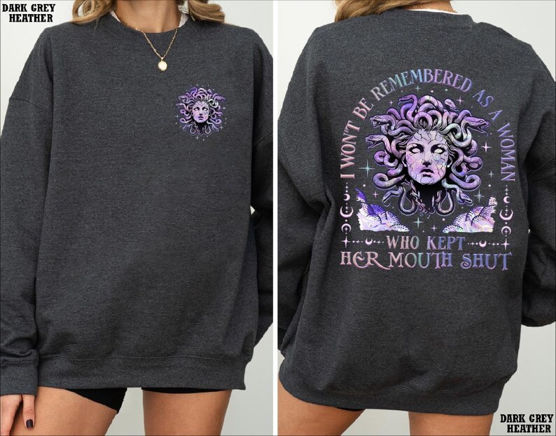 a woman wearing a sweatshirt with an image of a woman's face on it