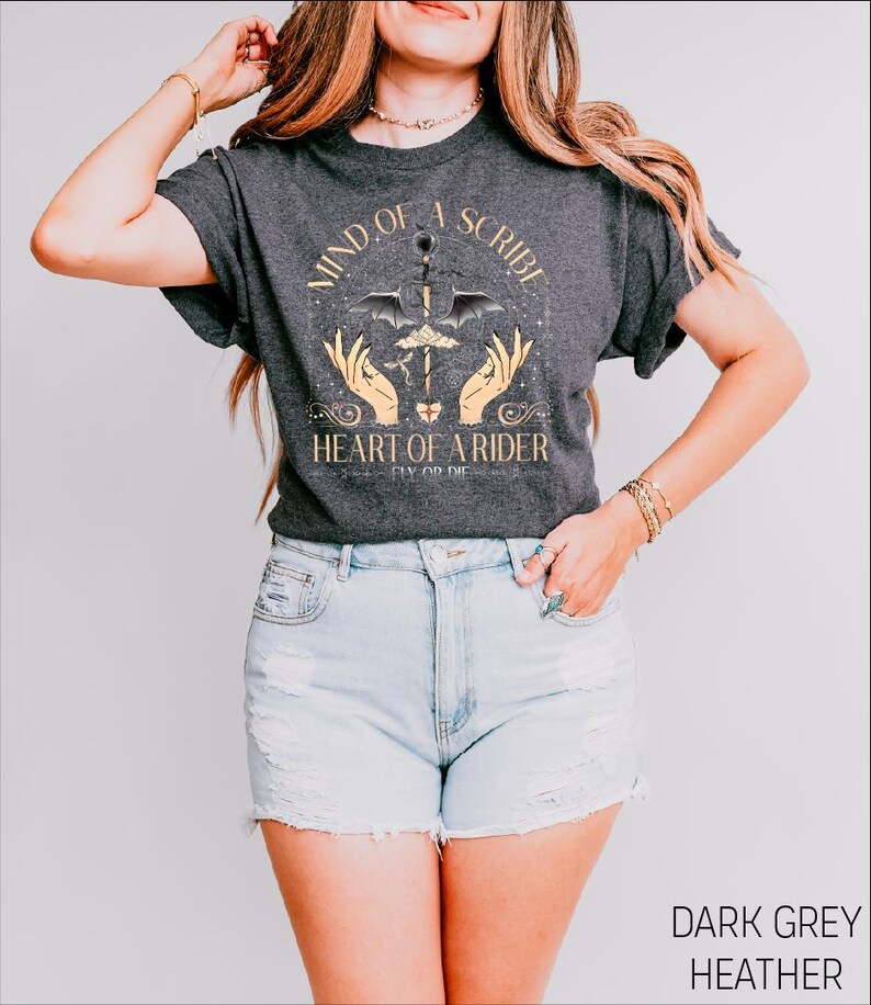 a woman wearing a black shirt and denim shorts