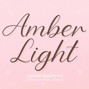 May include: A digital graphic with the words "Amber Light" in a flowing, brown script font. The text is set against a soft pink background with small white heart shapes. The phrase "a romantic script font" is below.