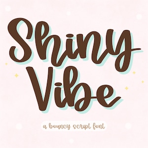 May include: A digital graphic featuring the words "Shiny Vibe" in a brown, bouncy script font with a light blue shadow effect. The text "a bouncy script font" is below the main text, on a light pink background.
