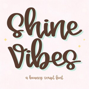 May include: Brown script lettering on a light pink background reads "Shine Vibes." The words have a light blue shadow effect. The phrase "a bouncy script font" is written below in a smaller font. Small yellow stars are in the background.