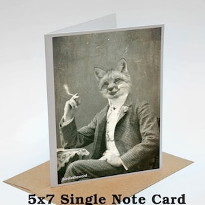May include: A vintage-style note card featuring a fox in a suit, holding a cigarette. The fox has a sly expression on its face. The card is 5x7 inches.