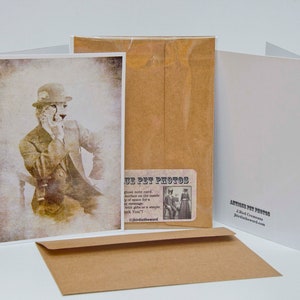 May include: A vintage-style greeting card featuring a cheetah wearing a hat and a suit. The card has a brown background and the text "Antique Pet Photos" is printed on the front.