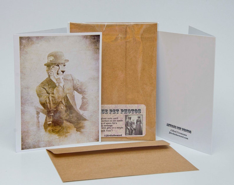 May include: A vintage-style greeting card featuring a cheetah wearing a hat and a suit. The card has a brown background and the text "Antique Pet Photos" is printed on the front.