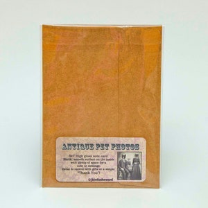 May include: A brown paper envelope with a white label that says "Antique Pet Photos" and has a picture of two cats dressed in clothing. The label also says "5x7 High gloss note card. Blank, smooth surface on the inside with plenty of space for a note or message. Great to receive with gifts or a simple "Thank You!" &copy;jbirdistheword"