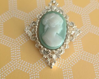 CLEARANCE Gerry's vintage cameo brooch, large gold colored with light green accent.