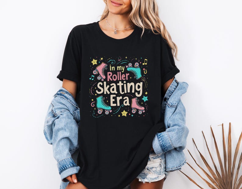 May include: Black t-shirt with a graphic design of roller skates and the text "In my roller skating era".