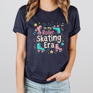 May include: A navy blue t-shirt with a graphic of roller skates and the text "in my roller skating era".