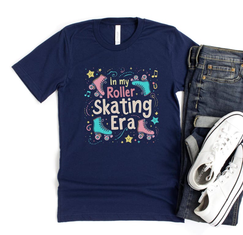 May include: Navy blue t-shirt with a graphic of roller skates and the text "In my roller skating era".