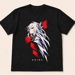 May include: A black short-sleeved t-shirt featuring a graphic print of an anime-style character with long white hair and red eyes. The design includes sharp red geometric shapes and the text SKIRK printed in white letters below the character.