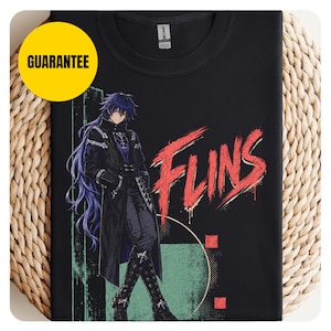 May include: A black crew neck t-shirt featuring a graphic of an anime-style character with long purple hair wearing a dark coat. The text FLINS is printed in a distressed red font next to the character, with green and red geometric accents.