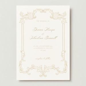 May include: A white wedding invitation with a gold ornate frame. The text reads "The Wedding of Denna Hroupe & Sebastian Bennell at 4 PM, 4th November 2023, 123 Anywhere St, Any City, ST 12345. Reception to follow."