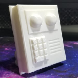 May include: White plastic panel with two round buttons and a keypad of nine buttons. The panel has a rectangular shape and a smooth surface.