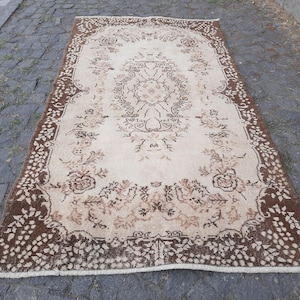 Faded Wool Turkish Rug: Vintage Area Rug, 7x10 ft