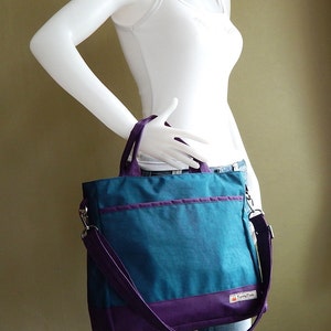 May include: A teal and purple tote bag with a purple shoulder strap and the text "Tingly Things" on the front.