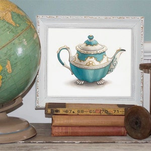 May include: A framed watercolor print of a teal and white teapot with gold accents. The teapot is displayed on a shelf with a vintage globe, books, and wooden spools. The teapot has a detailed design and a decorative lid.