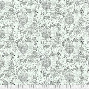May include: A light mint green fabric featuring a repeating dark gray pattern of ornate damask motifs, script handwriting, small stars, and various animals including skunks, zebras, and birds. A white ruler is visible at the bottom edge.