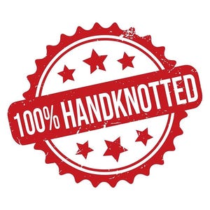 May include: A red stamp with the words "100% HANDKNOTTED" in white. The stamp is circular with a jagged edge and includes five stars. The text is in a rectangular shape that is angled across the circle.