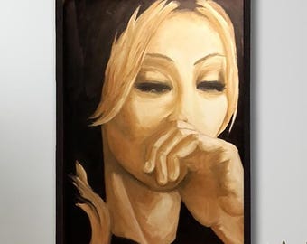 May include: A framed oil painting depicting a person with blonde hair and closed eyes, resting their chin on a hand. The portrait uses a monochromatic palette of warm golden tones and deep black shadows, set within a simple black frame.