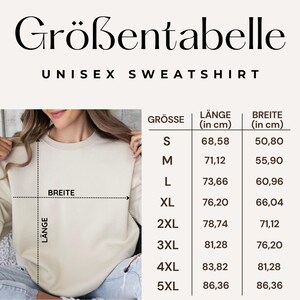 May include: A beige unisex sweatshirt with a size chart. The chart displays measurements in centimeters for length and width, ranging from size S (27 inches length, 20 inches width) to 5XL (34 inches length, 34 inches width).