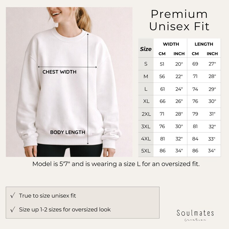 May include: A white unisex sweatshirt with chest width and body length measurements. The image includes a size chart with measurements in inches and centimeters. The model is 5'7" and wearing a size L for an oversized fit. The text says "Premium Unisex Fit".