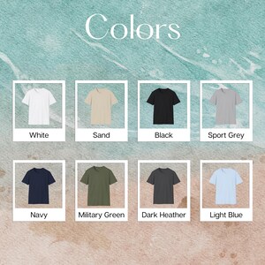 May include: Image showcasing a variety of t-shirt colors. The image displays eight different t-shirts in a grid, each in a different color: white, sand, black, sport grey, navy, military green, dark heather, and light blue. The word "Colors" is at the top.