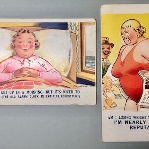 May include: Two vintage postcards with humorous illustrations. One shows a woman in bed with text: "It's nice to get up in a morning, but it's nicer to lie in bed!" The other depicts a woman in a swimsuit holding a newspaper, with text: "Am I losing weight? Don't be silly..."