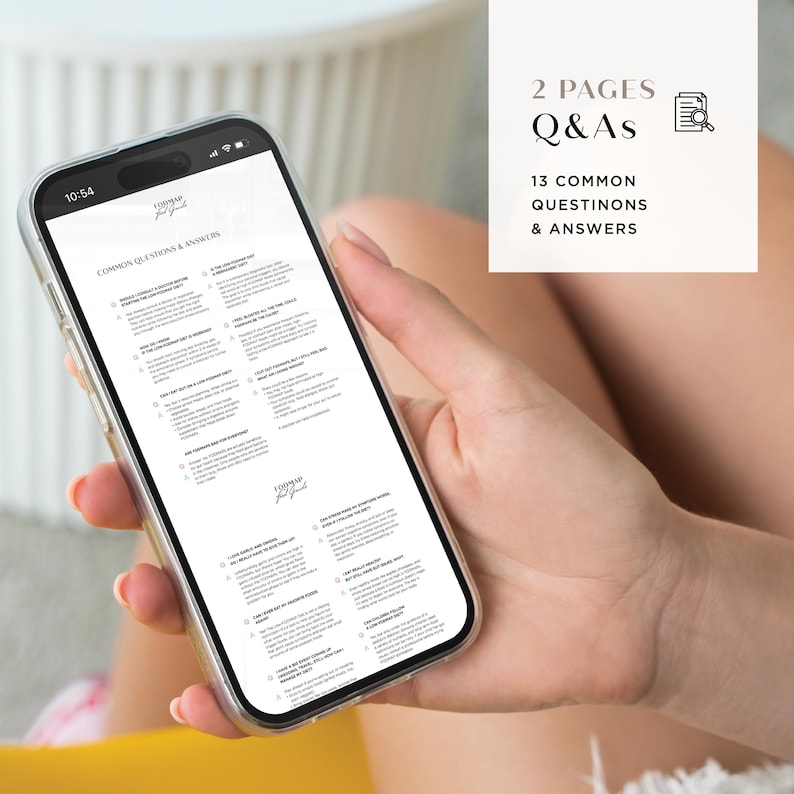 May include: A smartphone displaying a document titled "Common Questions & Answers". The document contains a list of questions and answers, likely related to a business or service. The document is divided into two pages and includes 13 common questions and answers.