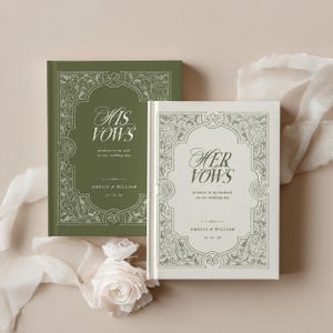 May include: Two wedding vow books, one olive green and one cream, with ornate floral borders. The green book reads "His Vows" and the cream book reads "Her Vows". Both books include the names Amelia & William and the wedding date.