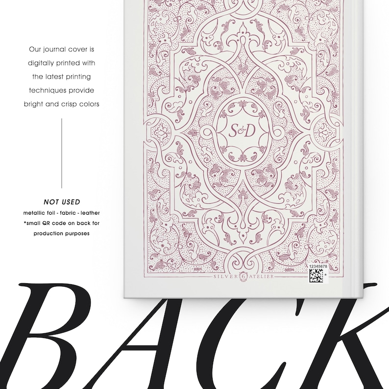 May include: A journal cover with a detailed, ornate design in shades of mauve and white. The cover features the initials "S&D" within an oval and the text "SILVER ATELIER". The journal cover is digitally printed with bright and crisp colors.