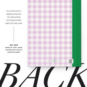 May include: A journal with a pink and white gingham pattern cover. The spine is green. The text on the cover says, "Our journal cover is digitally printed with the latest printing techniques provide bright and crisp colors."