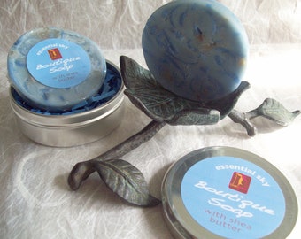 Essential Sky Soap handcrafted artisan glycerin soap with natural herbal soap shreds in a metal tin