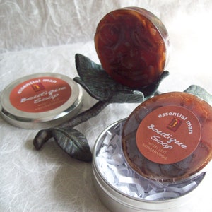 Essential Man Soap handcrafted artisan glycerin soap with Sandalwood soap shreds in a metal tin