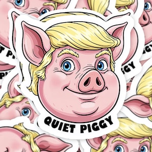 May include: A sticker featuring a cartoon pig with blonde hair and blue eyes. The pig is smiling, and the text "QUIET PIGGY" is printed in black on a white banner below the pig's face. The sticker has a white border.