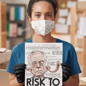 May include: A person wearing a floral face mask and black gloves holds a sign with a caricature and text. The sign reads "misinformation kills" and "Risk to public health."