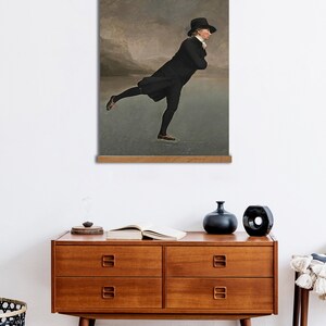 May include: A painting depicting a man ice skating on a frozen lake. He is wearing a black coat, black trousers, and a black hat. The sky is overcast and the lake is frozen.