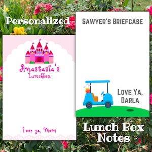 May include: Two personalized lunch box notes. One pink note features a castle graphic and the text "Anastasia's Lunchbox". The other note has a blue golf cart graphic and the text "Love Ya, Darla".