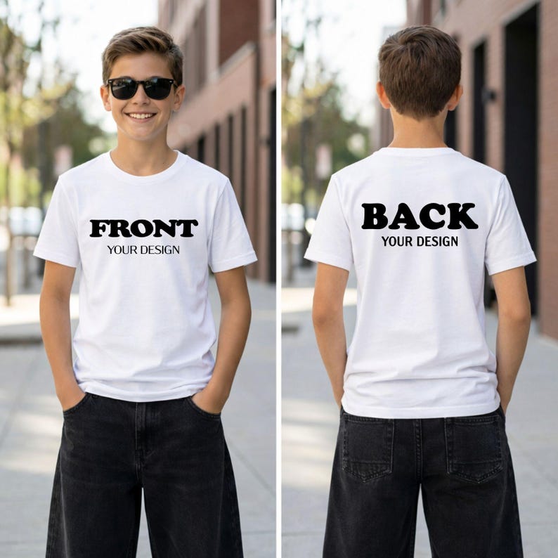 A young boy wearing a white t-shirt with the text "FRONT YOUR DESIGN" and "BACK YOUR DESIGN" printed on it, standing on a sidewalk.