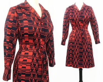 May include: A red and black geometric print dress with long sleeves and a tie belt. The dress has a collared neckline and button closure.