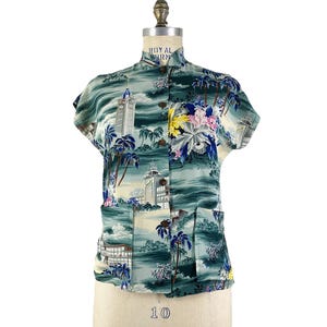 May include: A set of three ceramic nesting bowls in shades of blue, green, and white. The bowls have a speckled glaze and a simple, modern design. The largest bowl is about 20 cm in diameter.