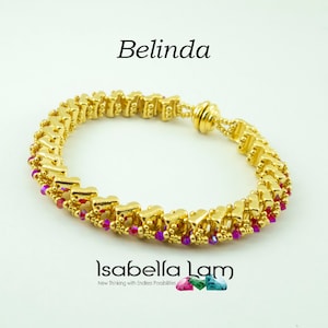 May include: Gold bracelet with a pink and purple crystal design. The bracelet is made of small, linked gold beads and features a magnetic clasp. The bracelet is called "Belinda" and is by Isabella Lam.