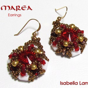 May include: A pair of gold earrings with red and white beaded designs. The earrings feature a central red gemstone surrounded by smaller red, white, and gold beads. The earrings are labeled "MAREA Earrings".