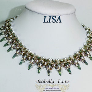 May include: A delicate beaded necklace with a cascading design featuring white pearls, green and gold beads, and purple accents. The necklace is displayed on a white mannequin bust with the word "LISA" printed above it.