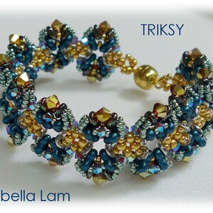 May include: A beaded bracelet with a gold clasp, featuring a repeating pattern of blue, gold, and green beads. The bracelet is called "Triksy" and is by Isabella Lam.