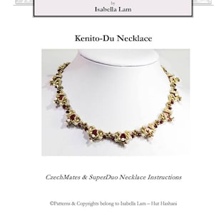 May include: A gold and red beaded necklace with a V-shaped design. The necklace is called "Kenito-Du Necklace" and is by Isabella Lam. The text "CzechMates & SuperDuo Necklace Instructions" is also included.