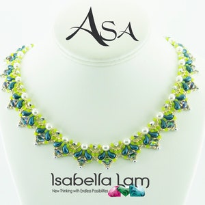 May include: A green and blue beaded necklace with a white pearl accent. The necklace is on a white display stand. The text "Asa" and "Isabella Lam" is visible on the stand.