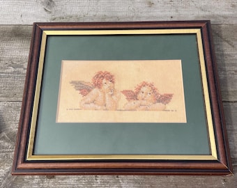Framed Cross Stitch Cherubs – Vintage Angel Wall Art – Rustic Needlework Decor – Mahogany Style Frame – Patina Aged Embroidery Pair
