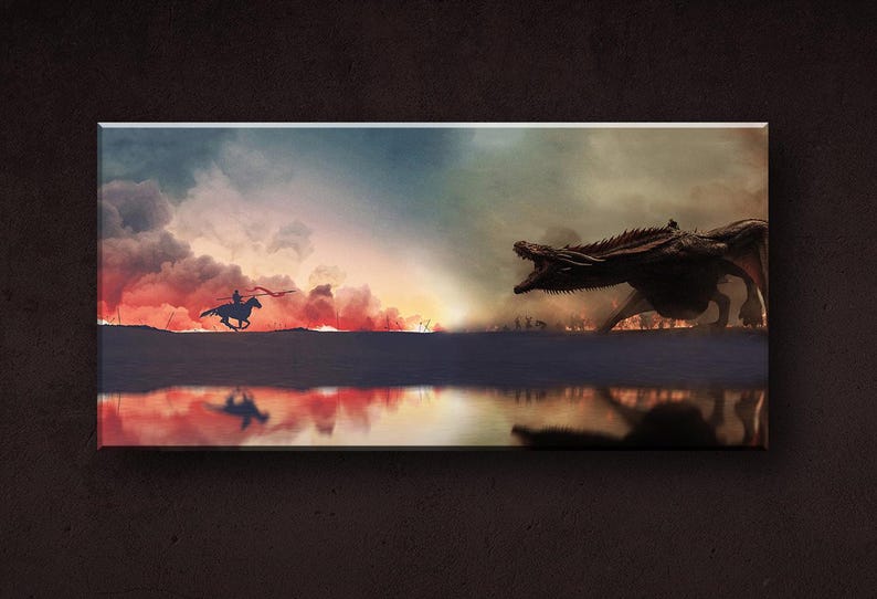 May include: A silhouette of a rider on horseback facing a large, dark dragon with red and orange clouds in the background. The dragon is facing the rider and has its mouth open. The scene is reflected in a body of water in the foreground.