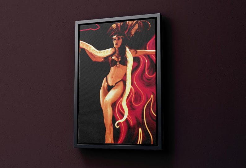 May include: A painting of a woman in a red and gold costume with a snake wrapped around her. The background is a dark red with a flame-like pattern.